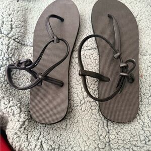 Black, super-comfy flip-flops with strap.
